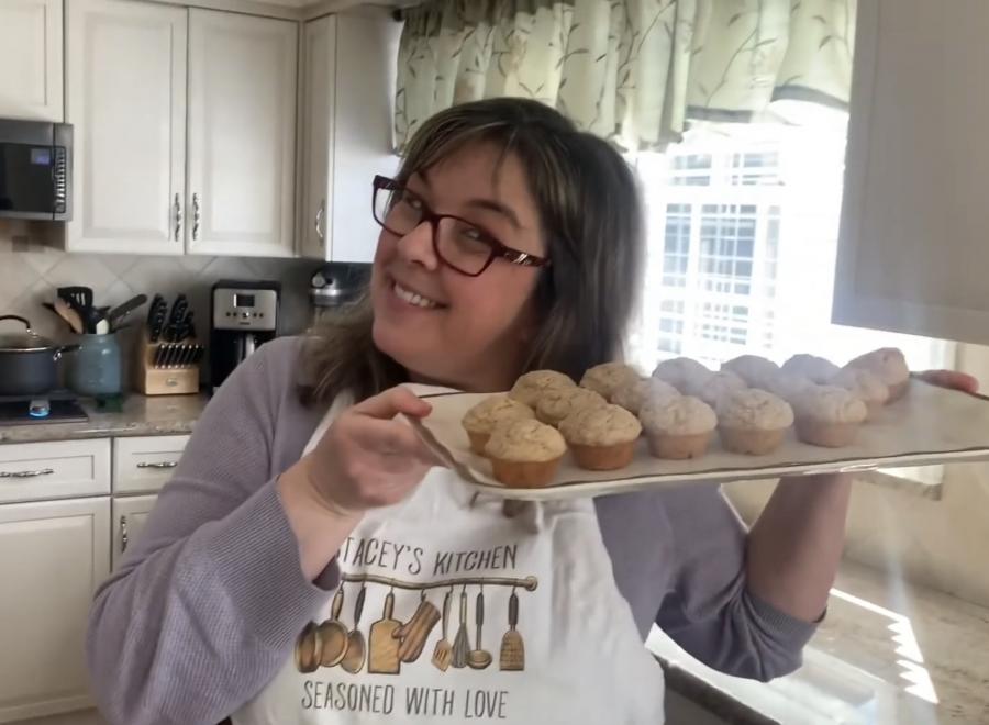 Miss Stacey holding muffins